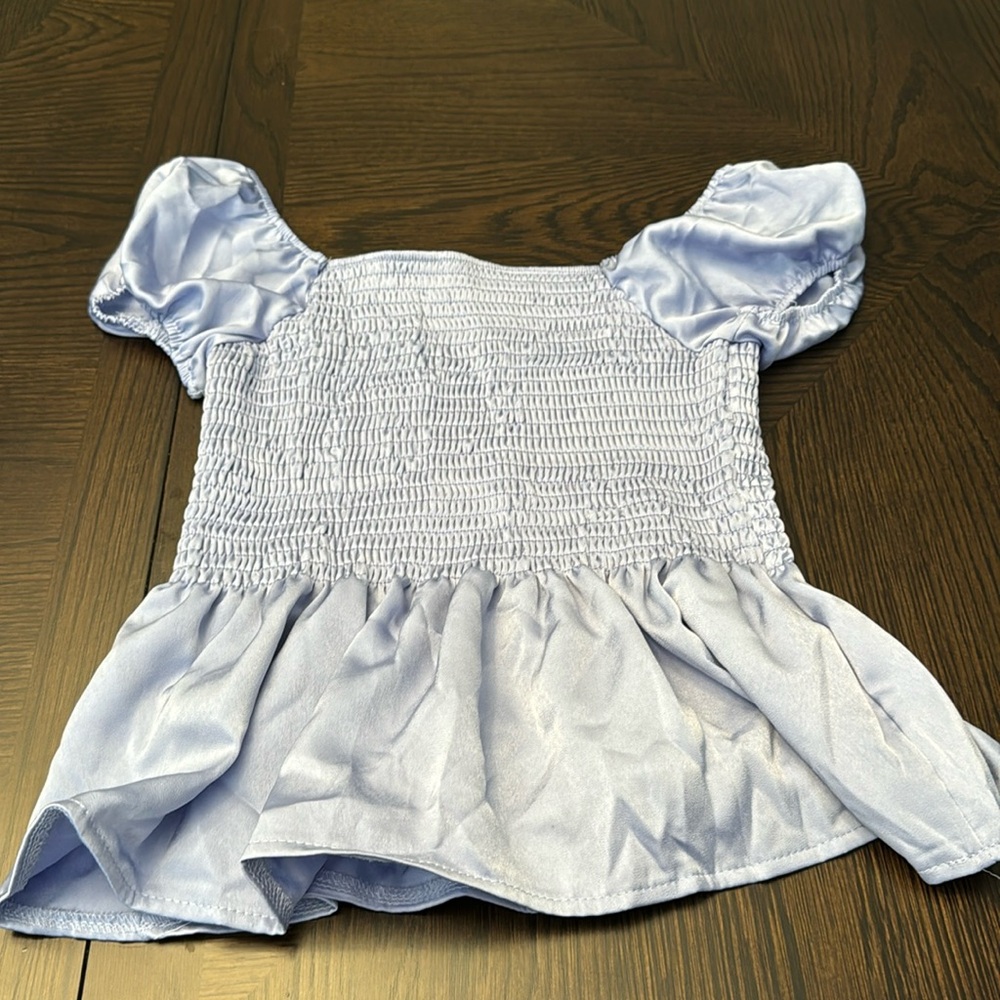 Suprelook size medium light blue satiny shirt with ruffles